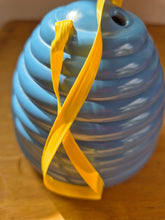 Load image into Gallery viewer, Beehive wool holder and needle gauge in blue plastic.
