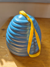 Load image into Gallery viewer, Beehive wool holder and needle gauge in blue plastic.
