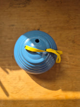 Load image into Gallery viewer, Beehive wool holder and needle gauge in blue plastic.
