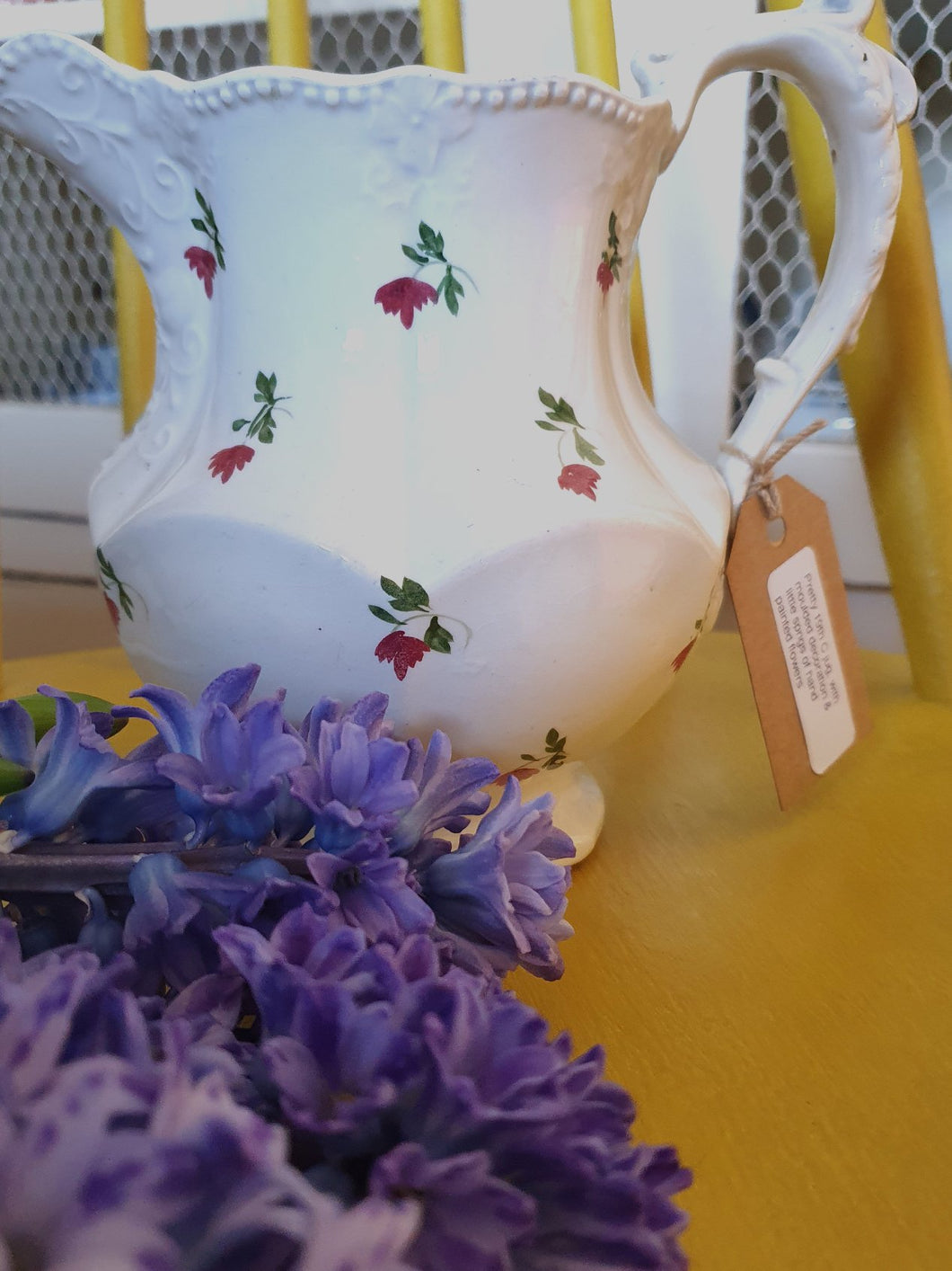 Pretty 19th century jug with moulded decoration and little sprigs of handpainted flowers