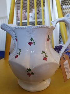 Pretty 19th century jug with moulded decoration and little sprigs of handpainted flowers